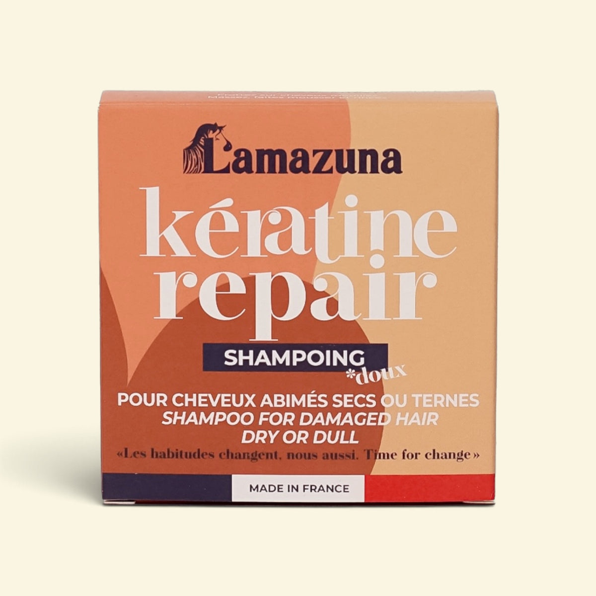 Lamazuna Kératine Repair Shampoo box in a peach-orange color with white and dark blue text, set against a light cream background.