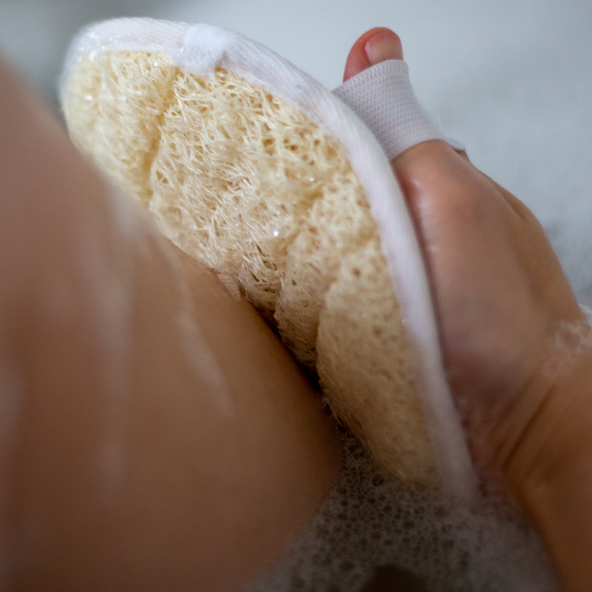 Loofah body scrub pad with hand strap